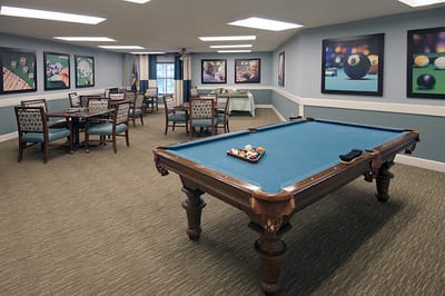 Interior of a common area with pool table and seating