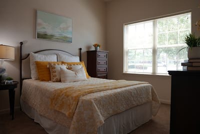Brightly decorated resident bedroom with a cozy atmosphere