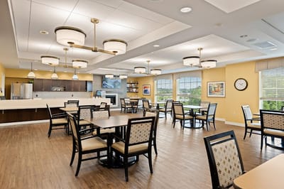 Interior view of a common area with tables and chairs