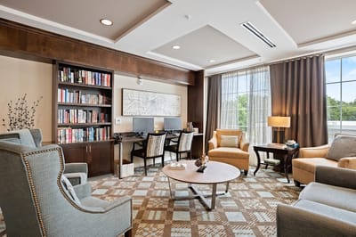 Interior common area with seating and bookshelves