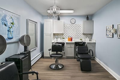 Beauty salon interior with two styling chairs and decor
