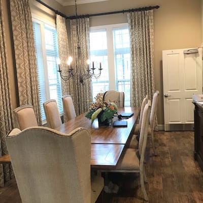 Dining room with large table and decorative chandelier