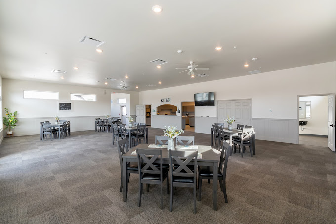 Interior of a spacious common area with tables and chairs
