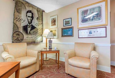 Cozy common area with chairs and artwork