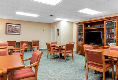 Interior activity room with tables and chairs