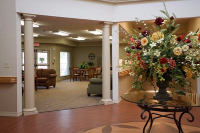 Lounge area with floral arrangement and seating