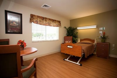 Cozy resident room with a bed and seating area