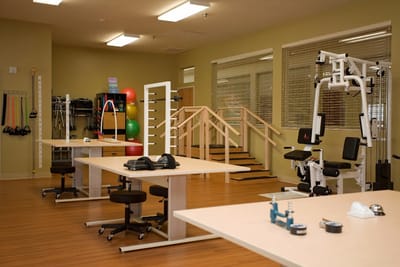 Exercise room with fitness equipment and therapy space