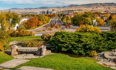 A scenic view of landscaped outdoor space with colorful trees