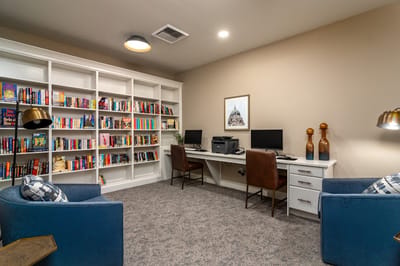 Cozy library corner with bookshelves and seating