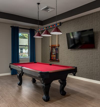 Interior view of a recreation room with a pool table