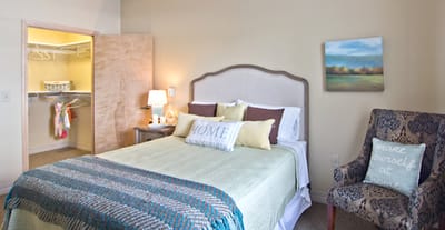 Cozy resident room with a bed and decorative elements