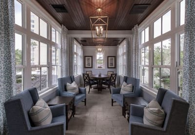 Cozy common area with large windows and seating