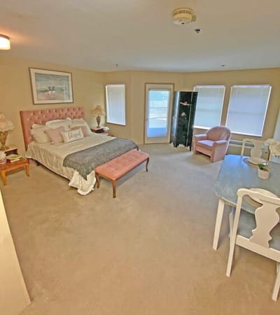 Well-furnished resident room with calming colors