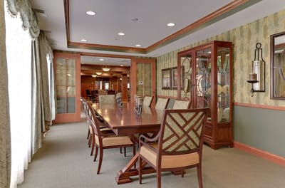 Bright common area with a large dining table