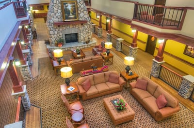 Spacious common area with cozy seating and a fireplace