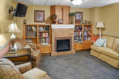 Cozy common area with bookshelves and seating