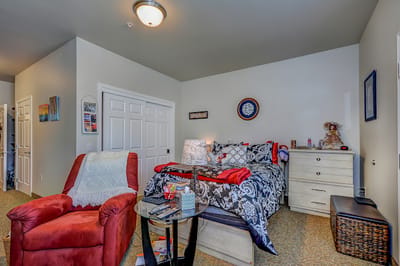Cozy resident room with a bed and personal decor