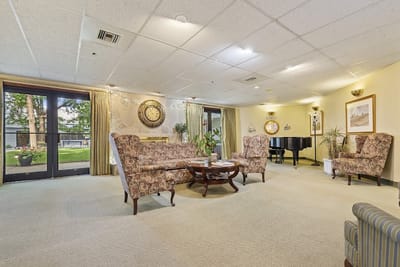 Cozy common area with seating and piano