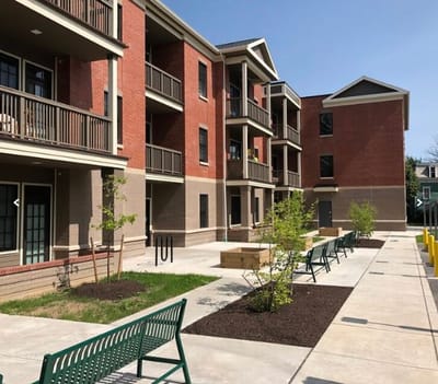 Exterior view of residential buildings with outdoor seating