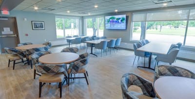 Bright common area with tables and chairs