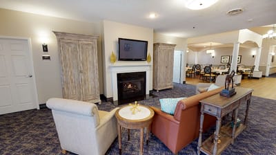Cozy common area with seating and a fireplace