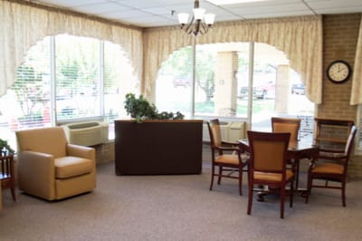 Bright common area with seating and large windows