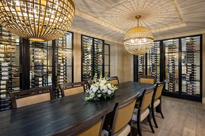 Elegant dining room with wine display and floral centerpiece