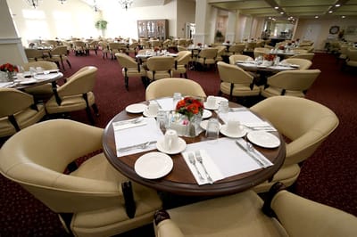 Dining room setup with tables and chairs
