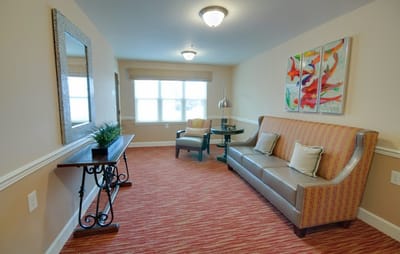 Cozy interior lounge area with seating and artwork