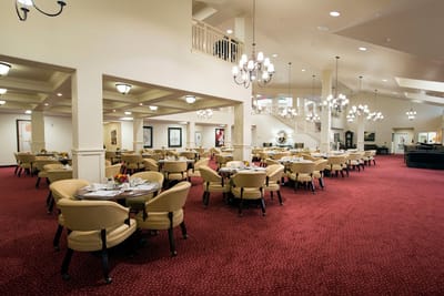 Elegant dining room with round tables and chandeliers