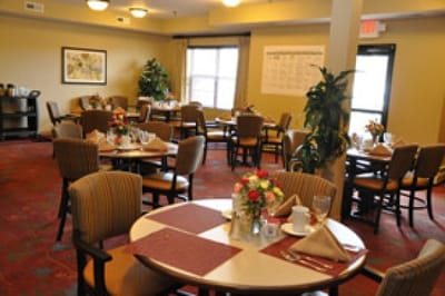 Dining area set up with flowers and table settings