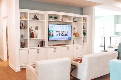 Common area with seating and a television display