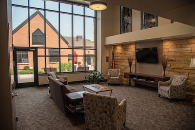 Interior view of a common area with seating and natural light