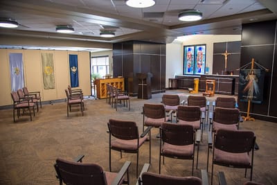 Interior chapel space with seating and decor