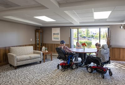Residents engaging in conversation in a common area