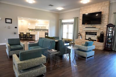 Bright common area with seating and TV