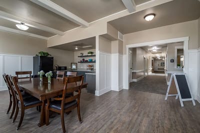 Common area with dining table and kitchenette