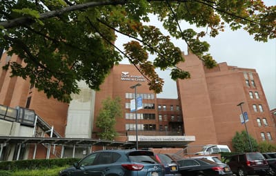 Exterior view of Saint Joseph Medical Center with vehicles