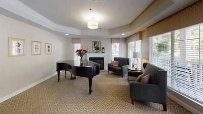 Cozy common area with a piano and seating