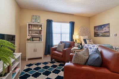 Cozy resident room with comfortable furniture and decor