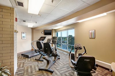 Fitness equipment in a well-lit exercise room