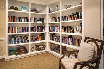 Interior bookshelf with various titles in a common area