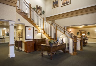 Indoor common area with a staircase and decorative furnishings