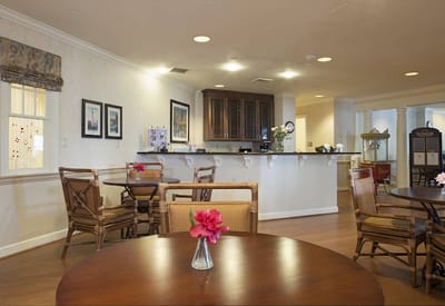 Common area with tables and flowers in vases