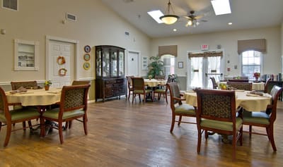 Dining room in a senior living facility with tables set