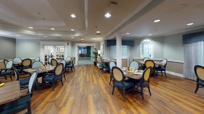 Bright dining room with tables set for meals