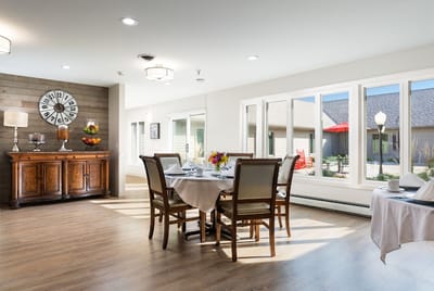 Bright dining area with tables and chairs