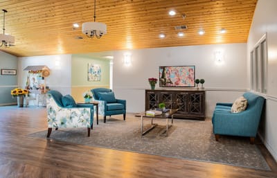 Bright interior seating area with blue chairs