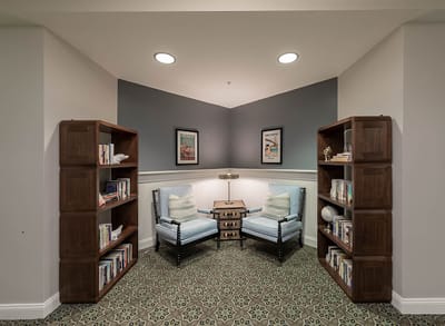 Interior common area with seating and bookshelves